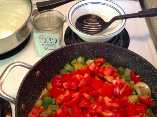 adding diced tomatoes to okra stew